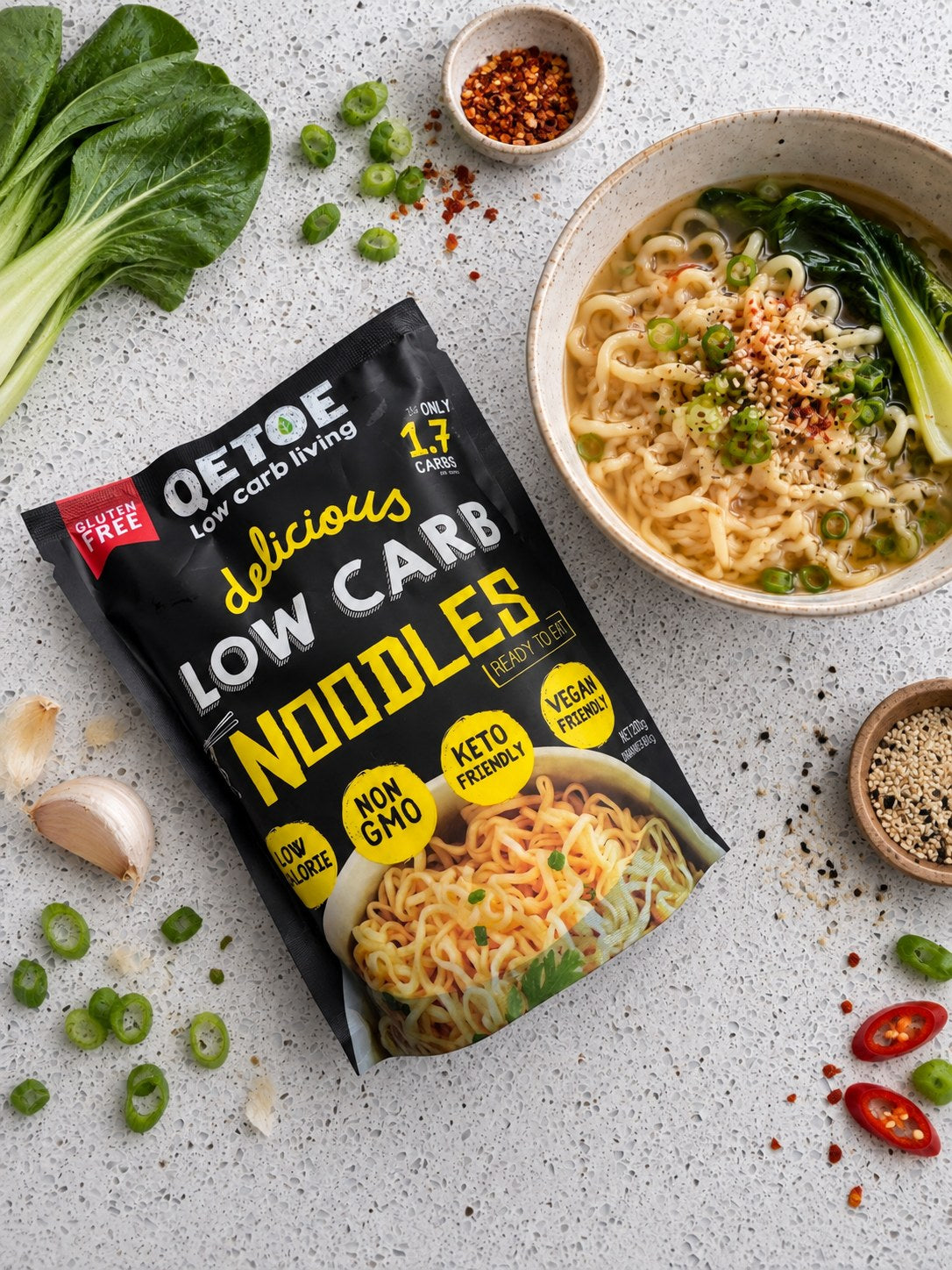 Qetoe Low Carb Noodles pack with a bowl of noodles